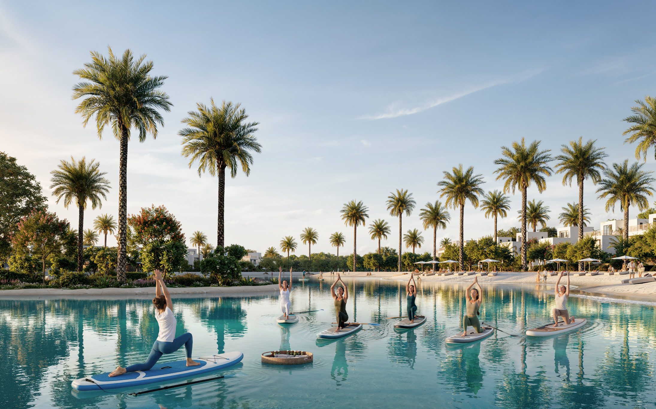 Paddleboard yoga on the palm-fringed lake beside the beach