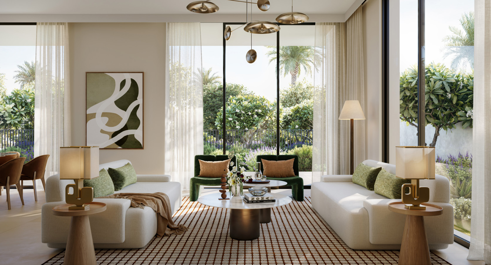 Living room with cream sofas and green velvet chairs facing the garden